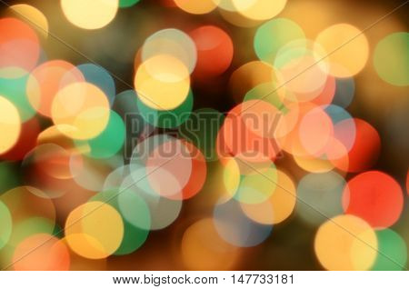 Bright christmas eve background. Plenty of golden sparkling bokeh from defocused garland lights. Backdrop for design