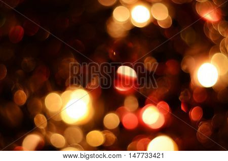 Bright christmas eve background. Plenty of golden sparkling bokeh from defocused garland lights. Backdrop for design