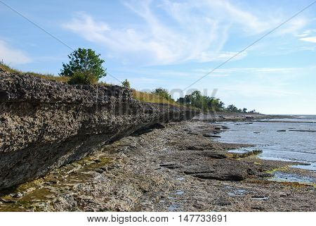 Overhang of eroded limestone cliffs at the swedish island Oland in the Baltic Sea