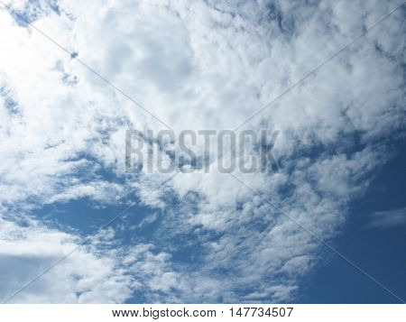 White clouds on blue sky. The clouds in the sky. Sky with clouds. Clouds background. Sky background. Heaven. Nature.