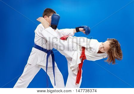 High kick leg and punch arm athletes are beating with overlays on hands