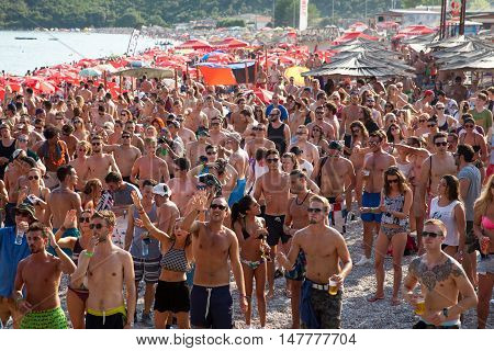 BUDV- JULY 17 : CROWD IN FRONT OF THE DANCE PARADISO STAGE DAY SESSION AT BEACH AT SEA DANCE FESTIVAL 2015 MUSIC FESTIVAL JULY 17 2015 IN BUDVA JAZ BEACH MONTENEGRO