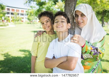 Muslim Arabic mother and kid in nature