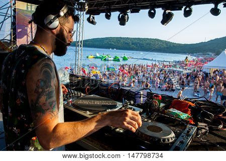 BUDVA- JULY 16 : DJ SESSION AND CROWD ON THE DANCE PARADISO STAGEAT SEA DANCE FESTIVAL 2015 MUSIC FESTIVAL JULY 16 2015 IN BUDVA JAZ BEACH MONTENEGRO