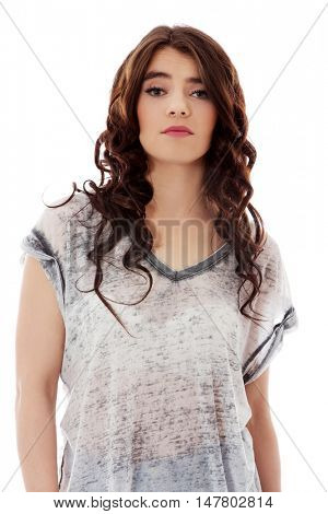 Young unhappy woman with long dark hair.