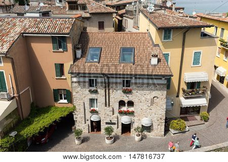 SIRMIONE ITALY - MAY 5, 2016: View of Piazza Catello from the Scaliger Castle in Sirmione Lake Garda Italy
