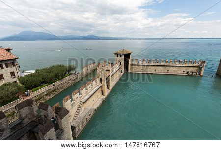SIRMIONE ITALY - MAY 5, 2016: Backwater inside the Scaliger Castle - medieval port fortress Sirmione Italy