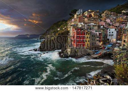 Riomaggiore. Image of Riomaggiore (Cinque Terre, Italy), during dramatic sunset.