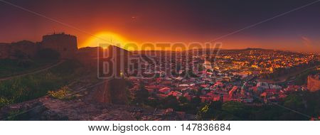 Ancient monastery in setting sun. Tatev. Armenia