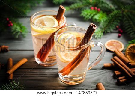 Two Toddy Cocktail Drinks with Cinnamon on Rustic Wood