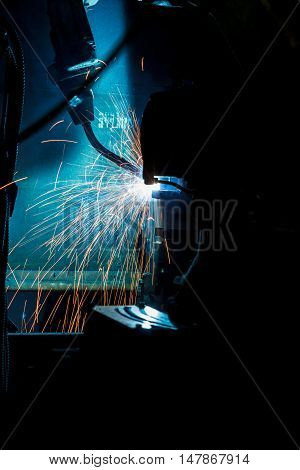 Welding robots movement in a car factory industry