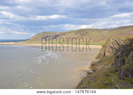 Rhossili Bay with distant people on beach. Gower Peninsular Wales UK