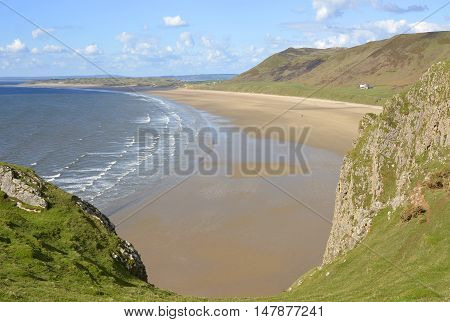 Rhossili Bay with distant people on beach. Gower Peninsular Wales UK