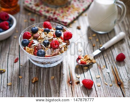 Healthy Coconut Granola with Nuts, Gogi Berry and Berries. Healthy breakfast. Selective focus.