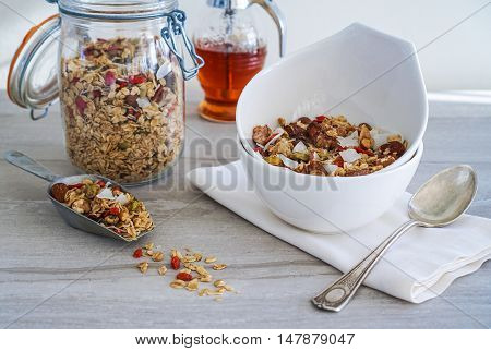 Healthy Coconut Granola with Nuts, Gogi Berry and Honey. Healthy breakfast. Selective focus.
