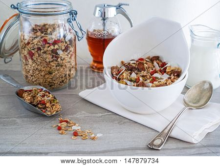 Healthy Coconut Granola with Nuts, Gogi Berry and Honey. Healthy breakfast. Selective focus.