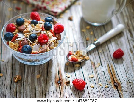 Healthy Coconut Granola with Nuts, Gogi Berry and Berries. Healthy breakfast. Selective focus.