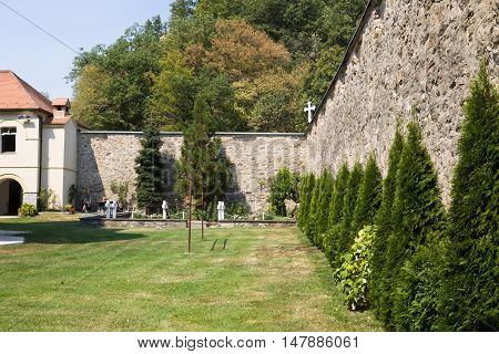 JAZAK, SERBIA - AUGUST 31, 2012: The monastic wall in the orthodox monastery Jazak in Serbia. The Jazak monastery is located in the northern Serbia in the province of Vojvodina. The monastery was founded in 1736.