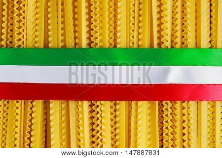 Uncooked Authenric Tripoline spaghetti pasta with italian flag style ribbons.