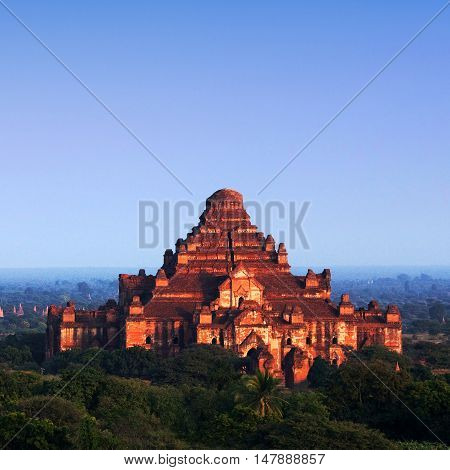 Ancient Dhammayangyi Pagoda at sunset in Bagan archaeological zone in Myanmar