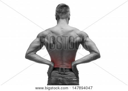 Middle aged man with pain in the kidneys muscular male body studio isolated shot on white background with red dot black and white photography