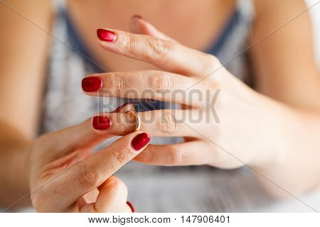 Woman Is Taking Off The Ring From Hand