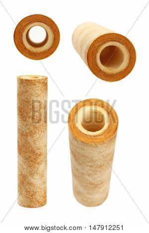 Used dirty rusty brown home sediment drinking water filter cartridge replacement for filtration and purification at pre-filter system isolated on white background close up