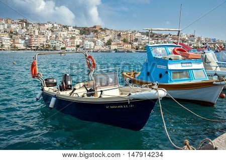SITIA, CRETE, GREECE -  JUNE 2016: Traditional Greek fishing boat at port of Sitia town at eastern part of Crete island, Greece