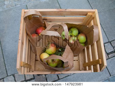 Wooden crate box full of fresh apples.