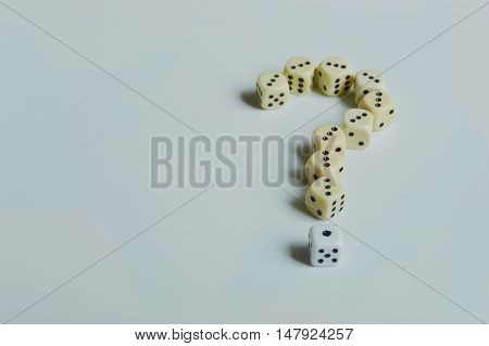 question mark on the floor made of dices