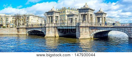SAINT PETERSBURG RUSSIA - APRIL 25 2015: Panorama of towered Lomonosov Bridge with architectural ensemble of Lomonosov Square on the background on April 25 in Saint Petersburg.