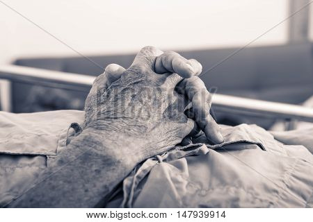 old man hand sleeping in a hospital