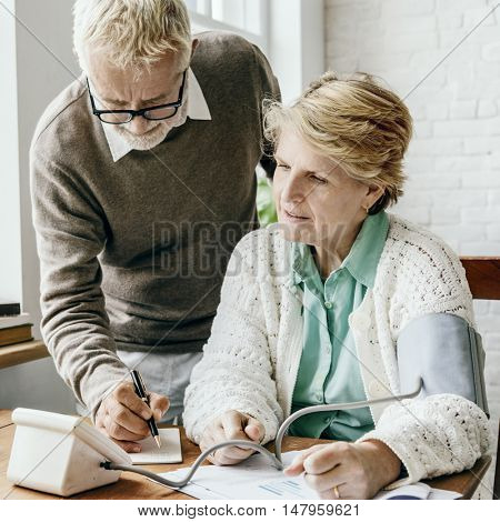 Senior Adult Measure Blood Pressure Healthcare Concept