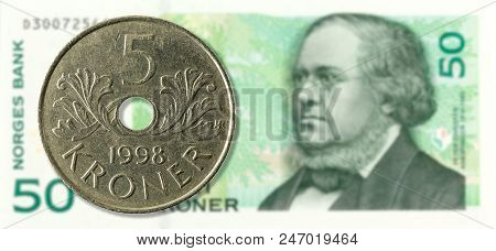 5 Norwegian Krone Coin Against 50 Norwegian Krone Bank Note Obverse