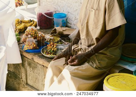Elderly Man Seller Is Selling Food At African Market