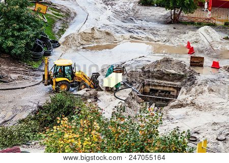 Repair Of Heating, Bulldozer Digging The Ground In The Rain