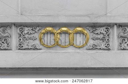 Ornamented House Detail Including 3 Interleaved Golden Rings