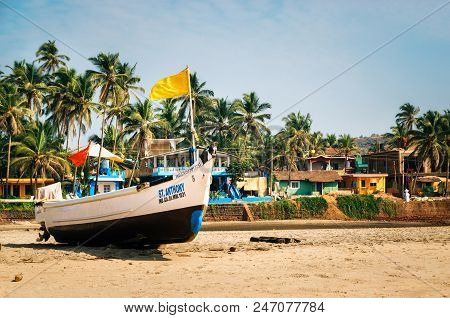 Goa, India - Dec 8,2014: Wooden Fishing Boat On Ashvem Beach Resort