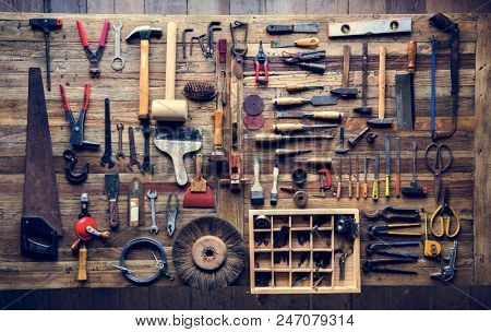 Aerial view of carpenter tools equipment set on wooden table