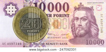 200 Hungarian Forint Coin Against 10000 Hungarian Forint Bank Note Obverse