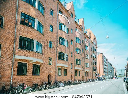 Copenhagen, Denmark - May 5, 2018: Urban Scene With Empty City Street With Parked Bicycles And Build