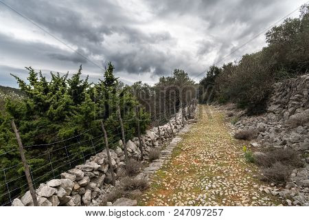 Old Roman Road In Cres (croatia) On A Cloudy Day In Spring