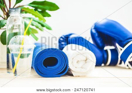 Set For Sports, A Yoga Mat, A Towel, Boxing Gloves And A Bottle Of Water On A Light Background. The 