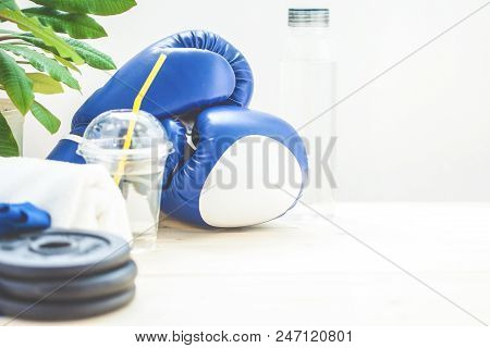 Set For Sports, Towel, Boxing Gloves, Dumbbell And A Bottle Of Water On A Light Background The Conce