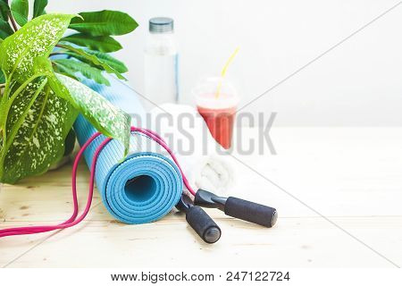 Set For Sports, A Yoga Mat, A Towel, Smoothies, Jumping Rope, A Bottle Of Water. The Concept Of A He
