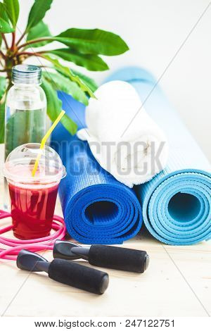 Set For Sports, A Yoga Mat, A Towel, Smoothies, Jumping Rope, A Bottle Of Water. The Concept Of A He