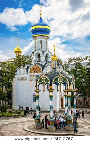 Sergiyev Posad, Russia - August 30, 2012: Pilgrims And Tourists At Assumption Wellspring And The Tem