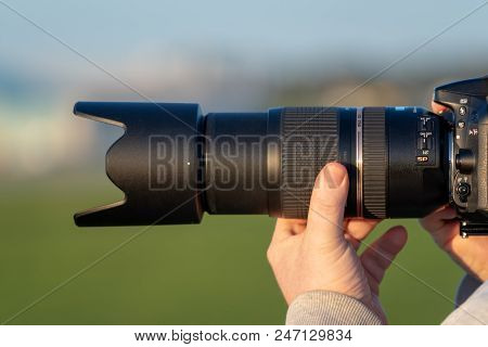 Gdansk, Poland - May 5 2018: Photographer Holding Camera Lens And Taking Photo.