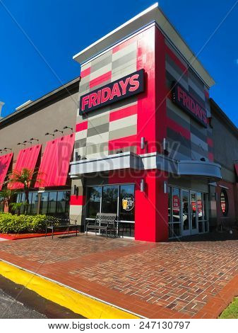 Orlando, Usa - May 8, 2018: Tgi Fridays Exterior And Logo. Tgi Fridays Is An American Restaurant Cha