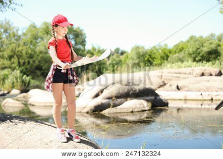 Little Girl With Map Outdoors. Summer Camp